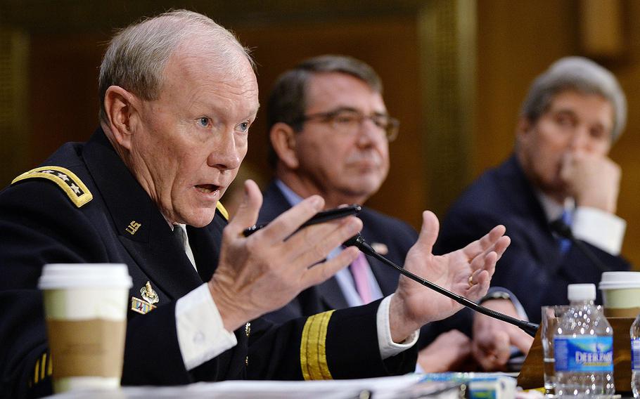 Chairman of the Joint Chiefs of Staff Gen. Martin Dempsey, left, testifies at a Senate Foreign Relations Committee hearing on Capitol Hill, March 11, 2015. Joining him were Secretary of State John Kerry, right, and Defense Secretary Ashton Carter.