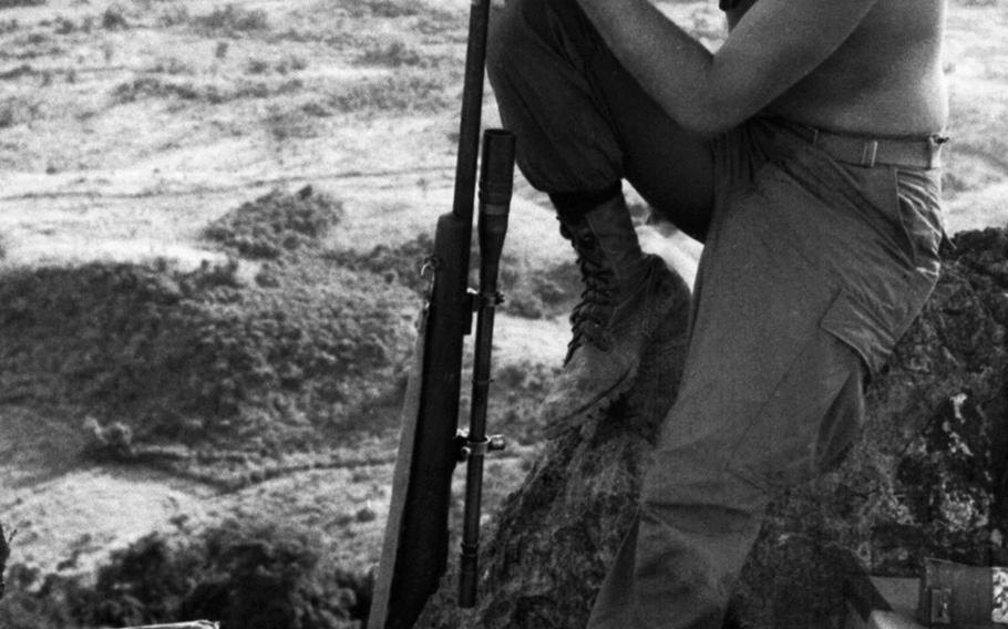Lance Cpl. Steven Perlewitz of Algoma, Wisconsin, a sniper with 1st Marine Division/4th Marines (Reinforced), looks out over the Vietnamese countryside from the Rockpile in October, 1966. Perlewitz was killed in action on February 26, 1967 in Thua Thien province. His name is engraved on panel 15E, row 99 of the Vietnam Veterans Memorial in Washington, D.C.