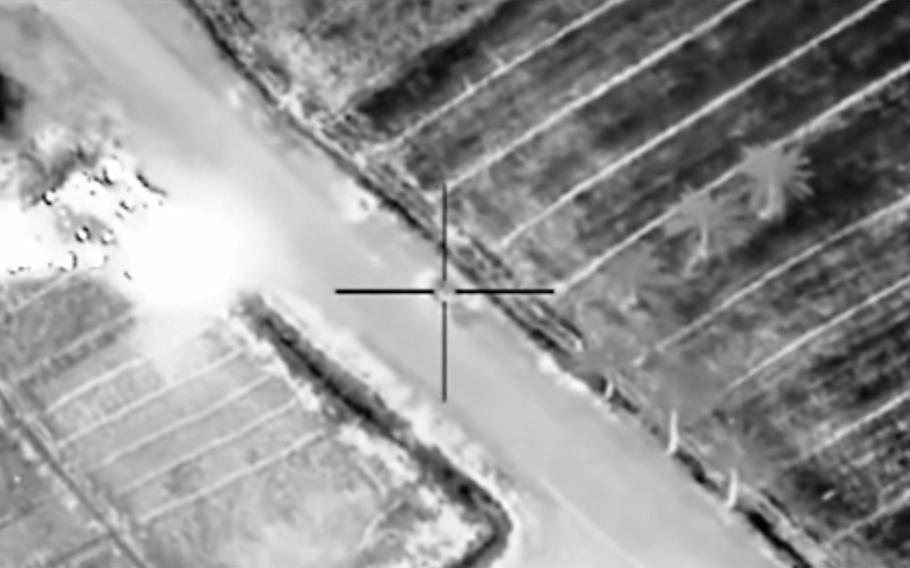 In this image taken from U.S. Central Command video, a coalition airstrike targets an Islamic State compound March 8, 2015, near Fallujah, Iraq.