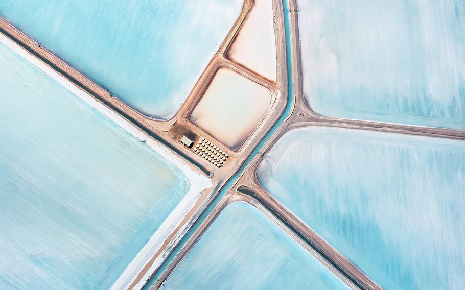 Simon Butterworth, "Blue Fields, 1" | The images were shot from a light aircraft flying at between 4,000 & 5,000ft. The height was crucial in order to flatten perspective by using long focal lengths. Time of day and cloud cover were also critical, the abstract effect being heightened by complete lack of signifying shadow.