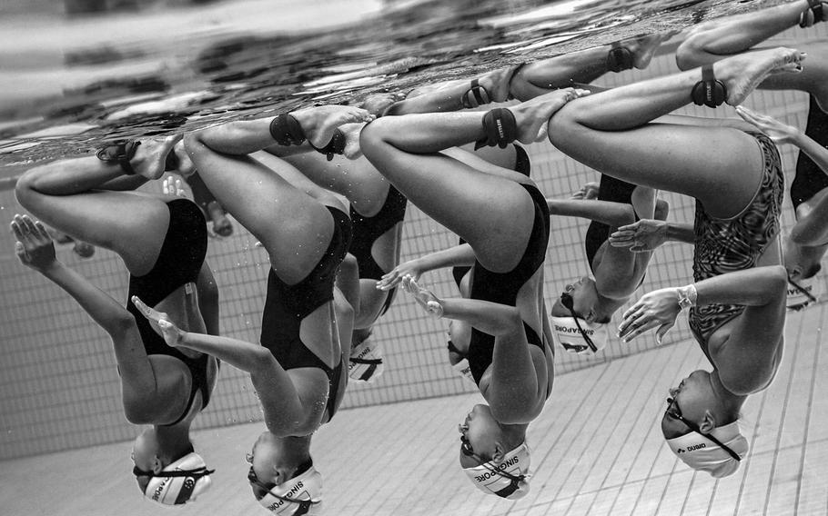 Jonathan Yeap Chin Tiong, "Underwater Grace 2" | The photographer attempts to capture the underwater grace and juxtaposition of the synchronized swimming team trainings in Singapore.
