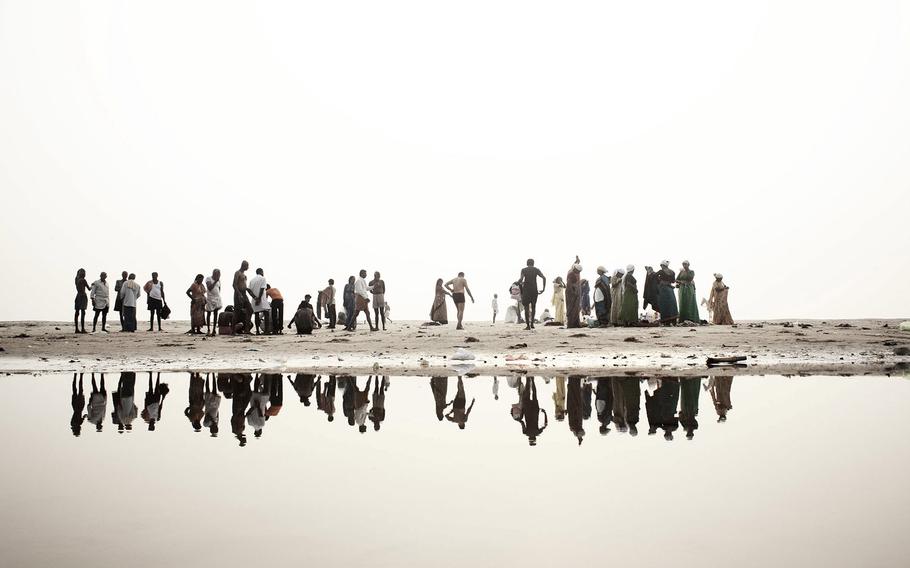 Giulio di Sturco, "Ganges, Death of a River, 2" | Hindu devotees' Along the banks of the river Ganges, get ready to soak in the water of the sacred river, India 2008.