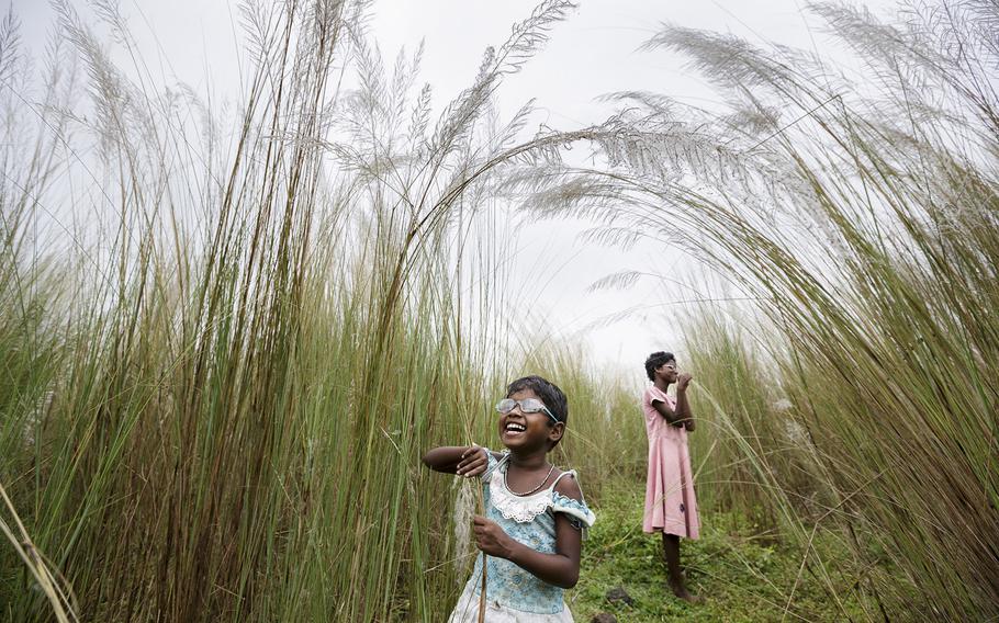 Brent Stirton, "First Sight 2" | Blind girls Sonia, 12, and Anita Singh, 5, are born into poverty with congenital cataract blindness. They must accompany their parents everywhere as they cannot be left alone without risk.