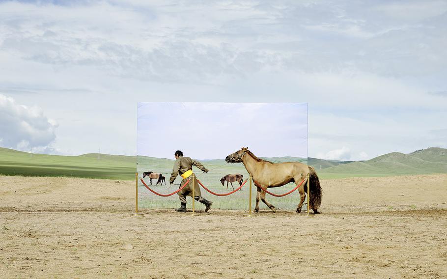 Daesung Lee, "futuristic archaeology 03" | This project attempts at recreating the museum diorama with actual people and their livestock in a real place where decertifying in Mongolia. It is based on an imagination that these people try to go into museum diorama for survival in the future. 