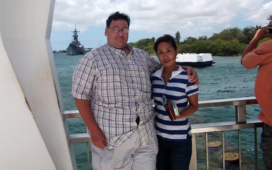 David and Li-Rong Radich pose at the USS Arizona Memorial in Honolulu. After his wife was brutally attacked in 2010, David Radich considered buying a handgun for self-defense, but laws currently prevent him from owning one on the U.S. Commonweath of Northern Mariana Islands.