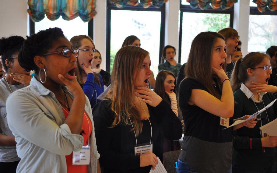 Vilseck's Crystal Morris, from left,  Alconbury's Mary Margaret McKillop, Patch's Chesney Walters and Ankara's Abigail Hansen practice a singing technique during rehearsals Tuesday at the annual DODDS-Europe Honors Music Festival in Oberwesel, Germany.