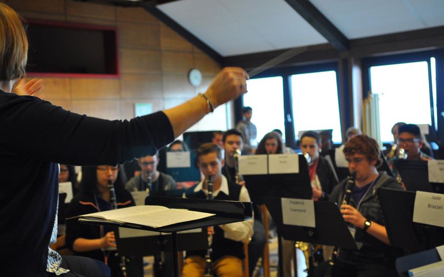 Mary Schneider, the guest instrumental conductor for this year's DODDS-Europe Honors Musical Festival, leads the band in rehearsals Tuesday, March 24, 2015, at the Oberwesel Youth Hostel in Germany.