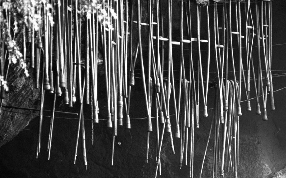 Discarded crutches at the Sanctuary of Our Lady of Lourdes, in 1964.