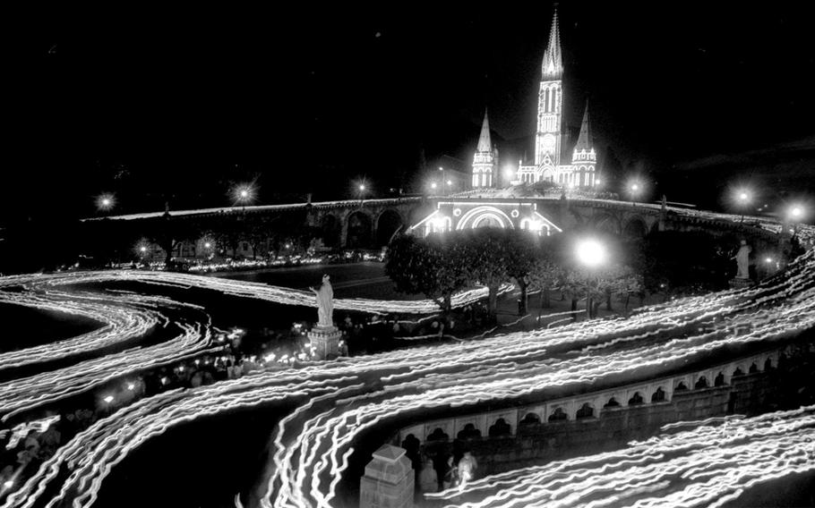 A time-lapse photo of the nighttime candlelight procession at the Sanctuary of Our Lady of Lourdes, in 1964.
