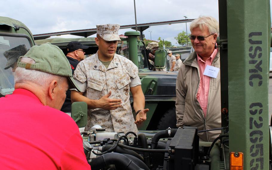 A Marine with 1st Reconnaissance Battalion talks to veteran David Estenson on Thursday, April 23, 2015, at Camp Pendleton, Calif., at a reunion of Vietnam-era reconnaissance Marines.