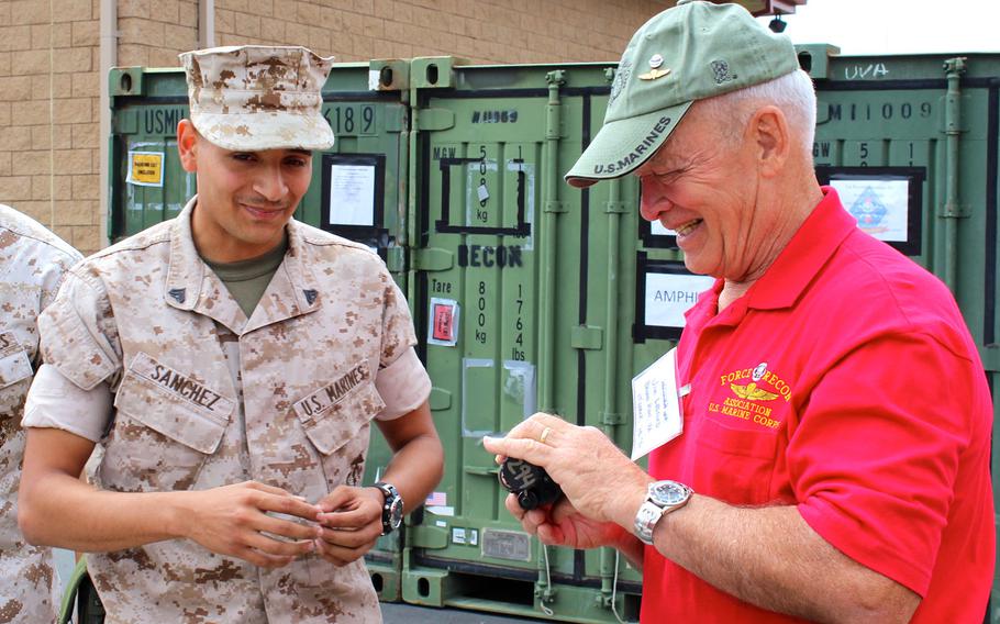 Jim Ledford, right, who served with 1st Force Reconnaissance Company in Vietnam from 1969-1970, checks out a scope at a reunion for Vietnam-era recon veterans Thursday, April 23, 2015, at Camp Pendleton, Calif.