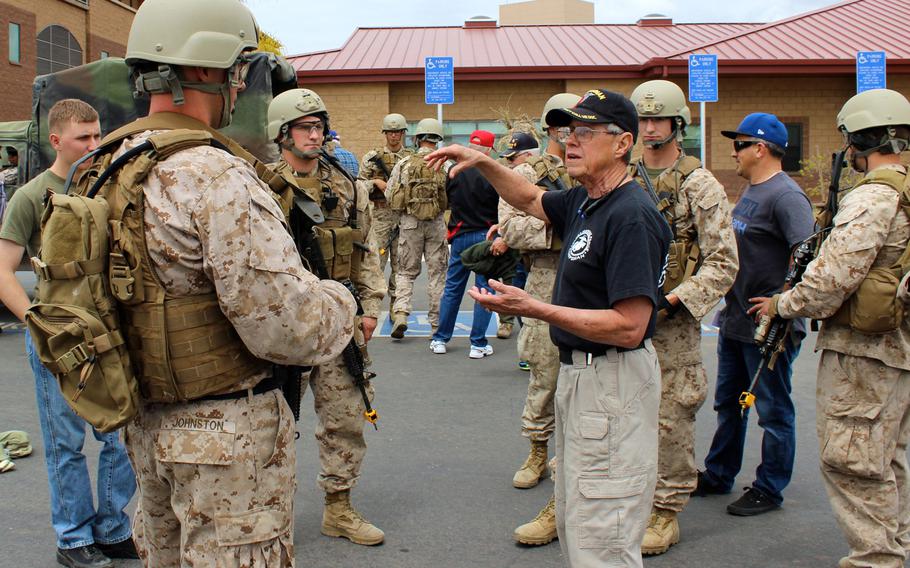 A Vietnam-era reconnaissance corpsman talks to current members of 1st Marine Reconnaissance Battalion on Thursday, April 23, 2015, at a recon reunion at Camp Pendleton, Calif., to commemorate the 50th anniversary of the U.S. entering the Vietnam War.