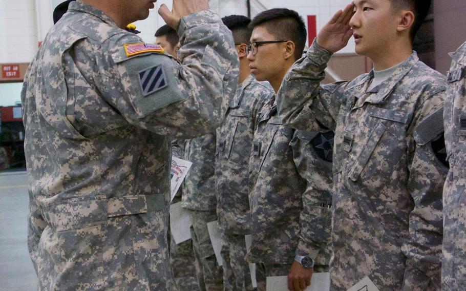 Korean Augmentation to the U.S. Army Soldier salutes the commander of 6th Squadron, 17th Cavalry Regiment, Lt. Col. Matthew F. Ketchum, during a welcoming ceremony June 26, 2014, at Camp Humphreys, South Korea. 
