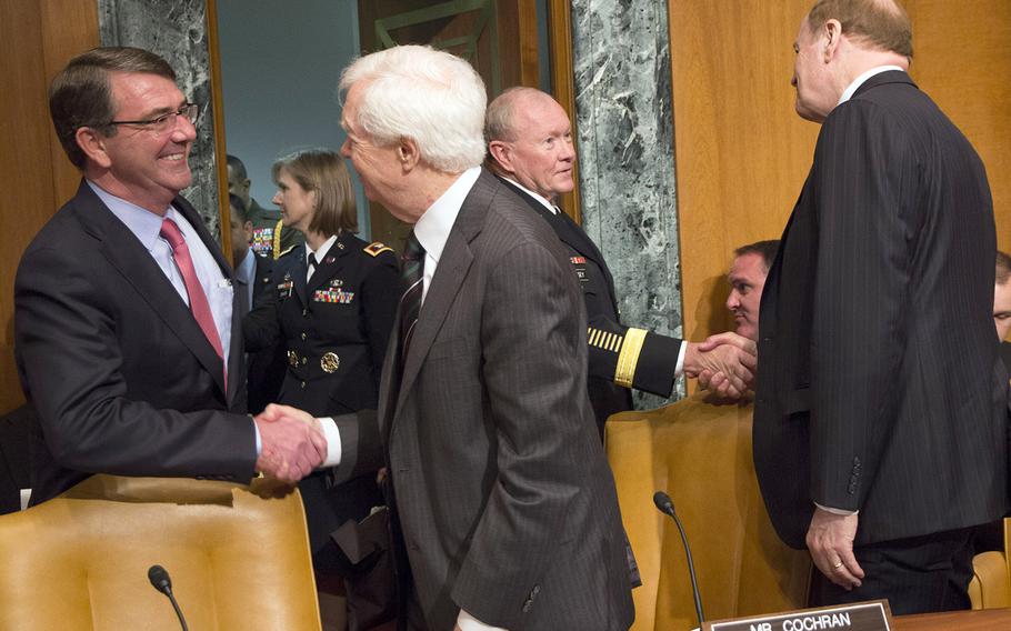 Secretary of Defense Ash Carter is greeted by Sen. Thad Cochran, R-Miss., and Joint Chiefs of Staff Chairman Gen. Martin Dempsey by Sen. Richard Shelby, R-Ala., before a Senate Appropriations subcommittee budget hearing on Capitol Hill, May 6, 2015.