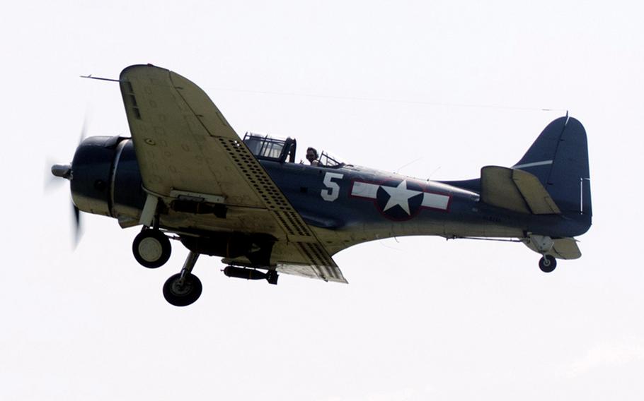 A pilot flies above the Culpeper Regional Airport Thursday, May 7, 2015 at the preview for the Arsenal of Democracy: World War II Victory Capitol Flyove.