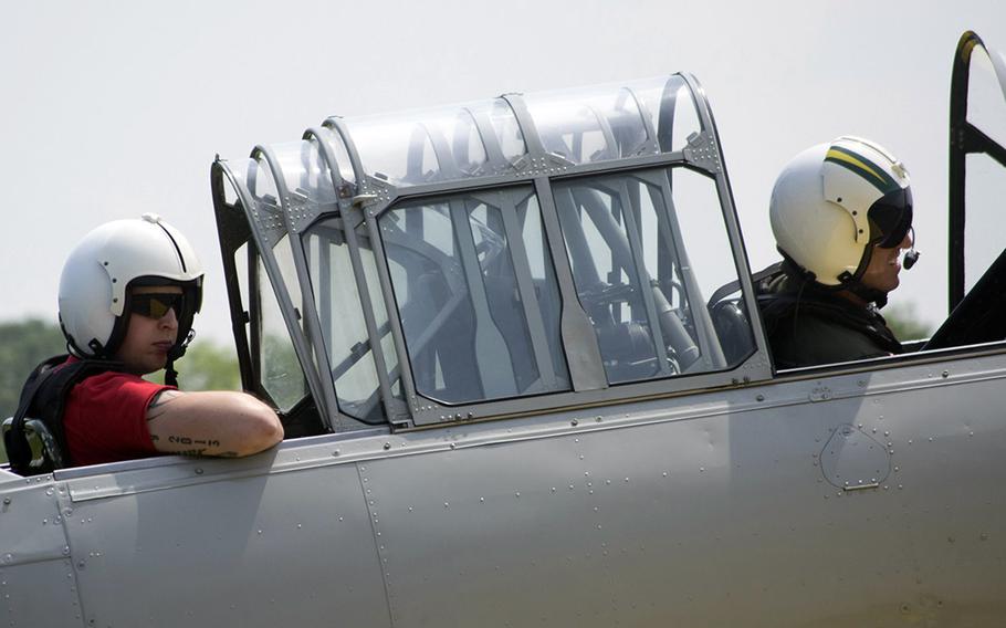 A pilot smiles after landing his plane at the Culpeper Regional Airport Thursday, May 7, during the preview for the Arsenal of Democracy: World War II Victory Capitol Flyover.