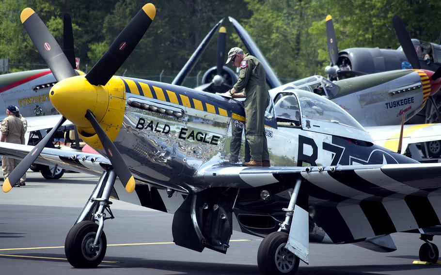 A pilot checks his plane at the Culpeper Regional Airport Thursday, May 7, during the preview for the Arsenal of Democracy: World War II Victory Capitol Flyover.