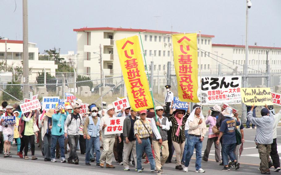Protesters block the gate to Camp Schwab, Okinawa, in April 2015 following the arrest of a protester for assaulting Japanese police. Organizers say a protest rally planned for Sunday, May 17, 2015, against a new U.S. military runway being built at Camp Schwab could draw as many as 30,000 people.