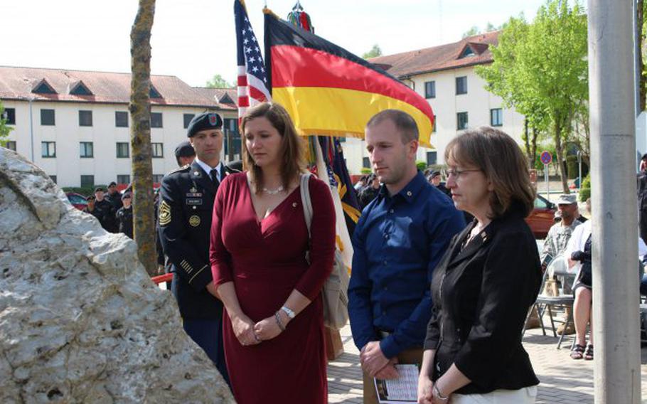 Gold Star family members Nickayla Garner, Evan Masterson and Sandy Masterson remember their Soldier at the unveiling of a new memorial in Hohenfels, recently erected to honor those 1st Battalion, 4th Infantry Regiment members killed in Afghanistan between 2006-2010.