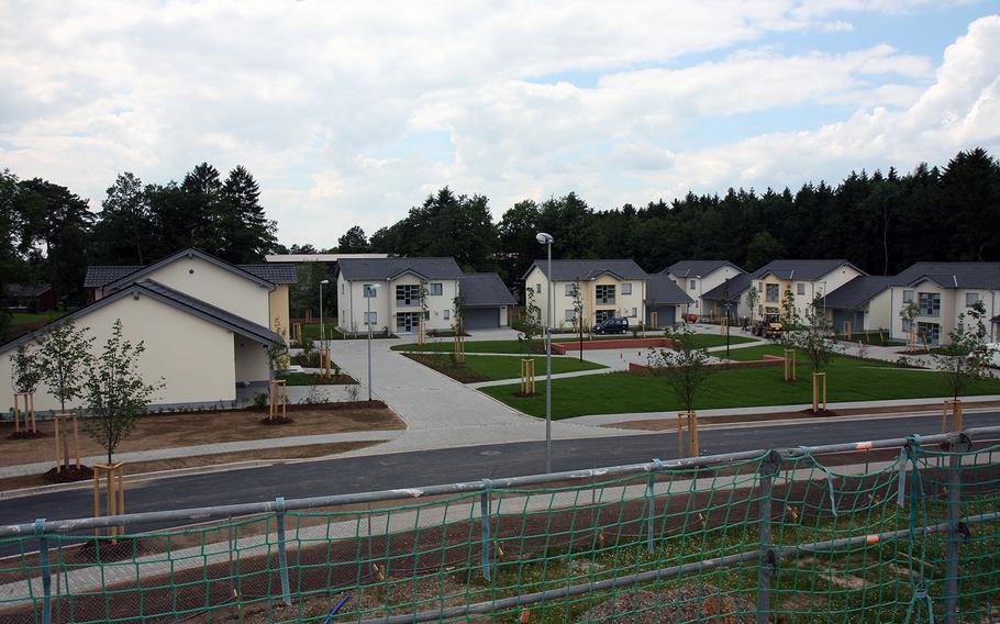 Seven completed housing units await their tenants in Spangdahlem Air Base, Germany. More than 130 other housing units were under construction across the street.