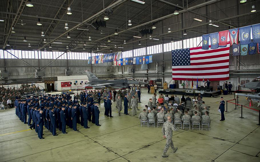 Airmen attend a ceremony in a hangar at a Spangdahlem Air Base, Germany, on June 18, 2015. Air Force officials in Europe will ask the Pentagon to consider forgiving over-payments of roughly $4 million in Overseas Housing Allowances to about 1,500 airmen.