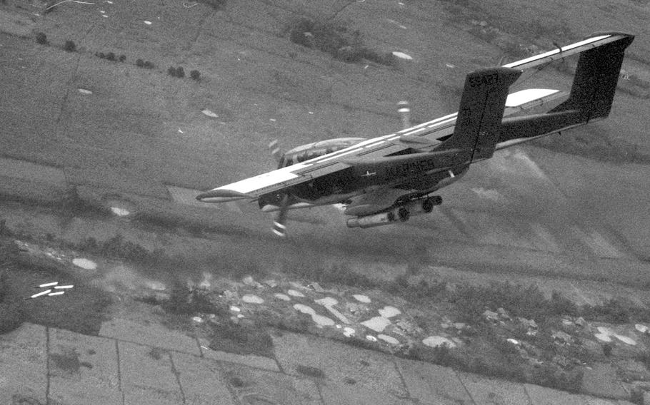 A U.S. Marine pilot unleashes four rockets (lower left) toward an enemy bunker in the An Hoa Basin, about 15 miles southeast of Da Nang, in December, 1968. The OV-10 Bronco from Marine Observation Squadron 2 was helping out in Operation Taylor Common 2.
