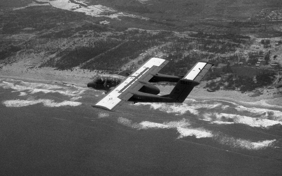 An OV-10 Bronco from Marine Observation Squadron 2 flies over the coast of South Vietnam in December, 1968.