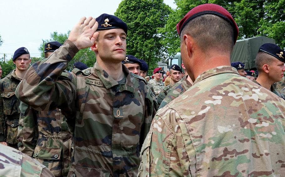 U.S. Army 82nd Airborne Division, French, and Germany  paratroopers exchange wings after commemorated the 72nd Anniversary of D-Day. 
