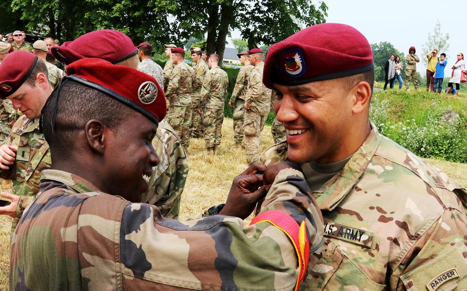 U.S. Army 82nd Airborne Division and French paratroopers exchange wings after 320 paratroopers from three countries, including Germany, commemorated the 72nd Anniversary of D-Day