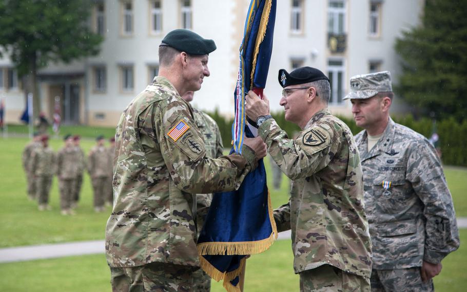 Maj. Gen. Mark Schwartz, the new head of U.S. Special Operations Command Europe, accepts the flag from  U.S. European Command's Gen. Curtis M. Scaparrotti during a ceremony Wednesday at EUCOM's Patch Barracks in Stuttgart. 

