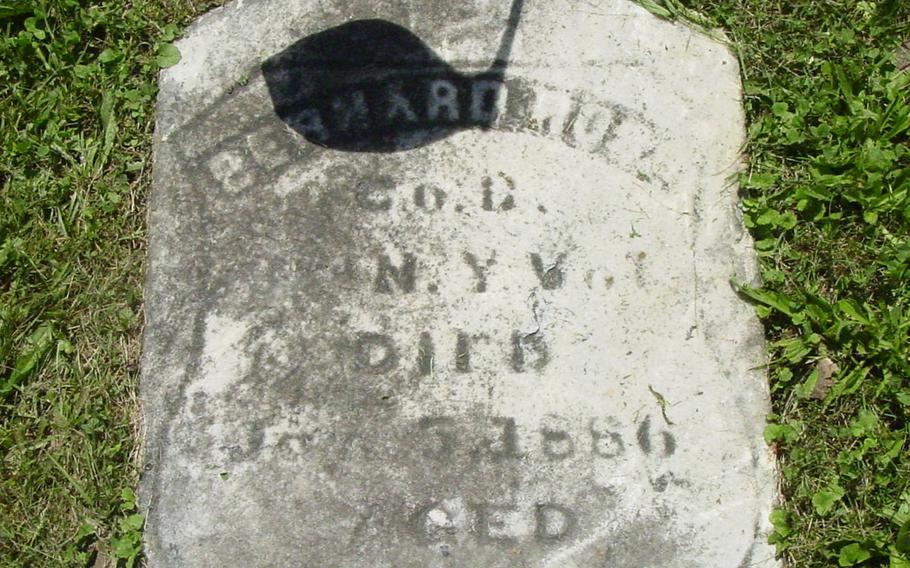 The faded tombstone of Bernard Ross, a drummer boy in World War I, buried at St. Agnes Cemetery in Menands, N.Y. The cemetery replaced the stone in a project to commemorate its veterans.