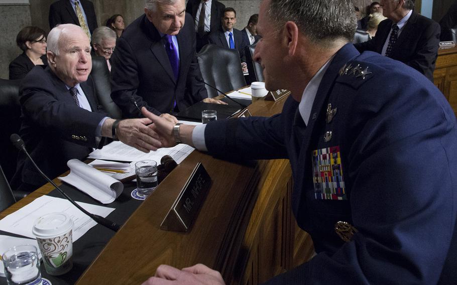 Air Force Chief of Staff nominee Gen. David L. Goldfein shakes hands with Senate Armed Services Committee Chairman Sen. John McCain, R-Ariz., before his confirmation hearing on Capitol Hill, June 16, 2016.
