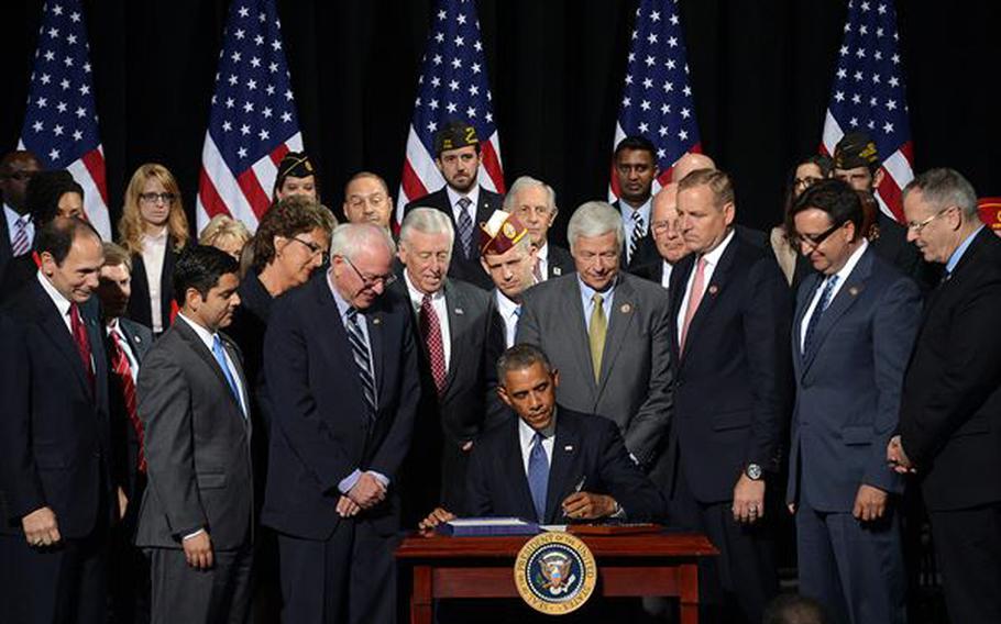 President Barack Obama signs the Veterans’ Access, Choice and Accountability Act of 2014, at Fort Belvoir, Va., on Aug. 7, 2014. The The Department of Veterans Affairs notified Congress on Friday that it will no longer enforce the law.