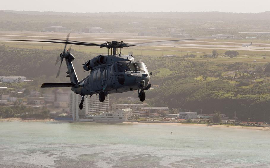 An MH-60S Seahawk helicopter assigned to Helicopter Sea Combat Squadron  25 is pictured during a photo exercise off the coast of Guam. Sailors from the Island Knights teamed up with Coast Guard Sector Guam and the local fire department to rescue two fishermen in a capsized boat off the coast of Tinian Saturday night. 