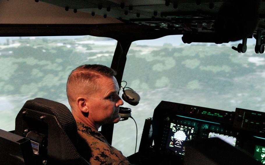 Brig. Gen. Russell A. Sanborn, commander of 1st Marine Aircraft Wing, sits in the cockpit of an Osprey MV-22 simulator during a demonstration June 28, 2016, at Marine Corps Base Hawaii.