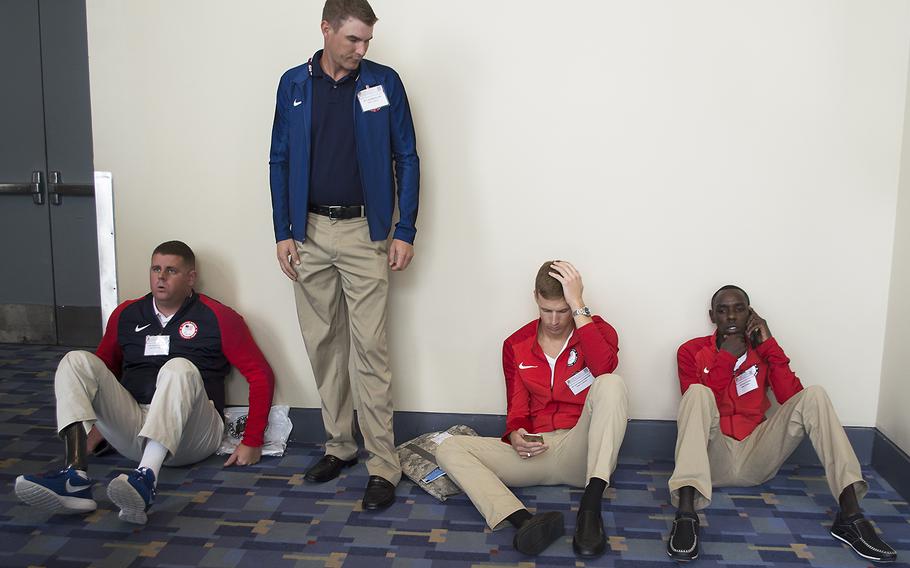 Paralympians Michael Lukow, Glenn Eller, Nathan Schrimsher and Paul Chelimo before the start of a media round table during the 2016 AUSA annual meeting in Washington, D.C., October 4, 2016.