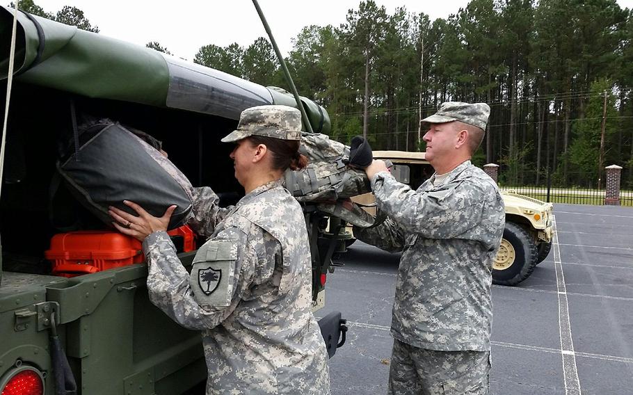 Soldiers with the 108th Public Affairs Detachment, South Carolina National Guard, load their military vehicle to assist Hurricane Matthew response at the McCrady Training Center,  Eastover, S.C., on Oct. 5, 2016.