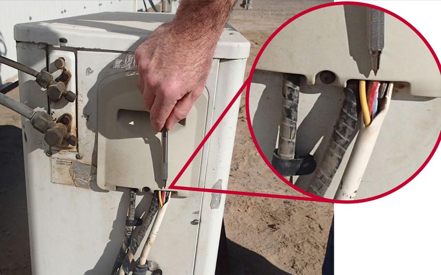 A photo from the DOD inspector general's report on Camp Buehring, Kuwait, shows improper HVAC wiring exposing conductors.