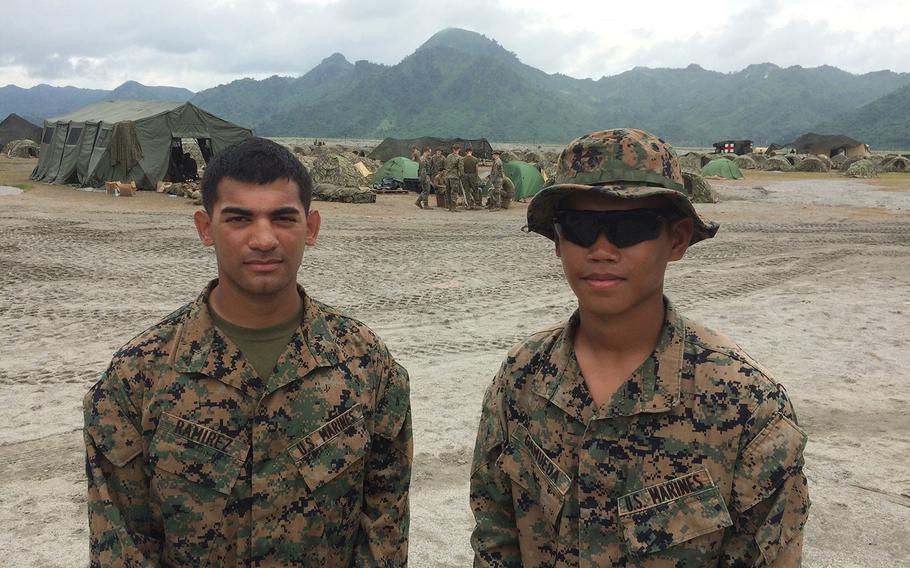 Lance Cpl. Steven Ramirez, 23, of Fort Wayne, Ind. and Lance Cpl. Kurt Gamueda, 20, of Sacramento, Calif. have been training with Philippines marines in Crow Valley, Philippines this week.
