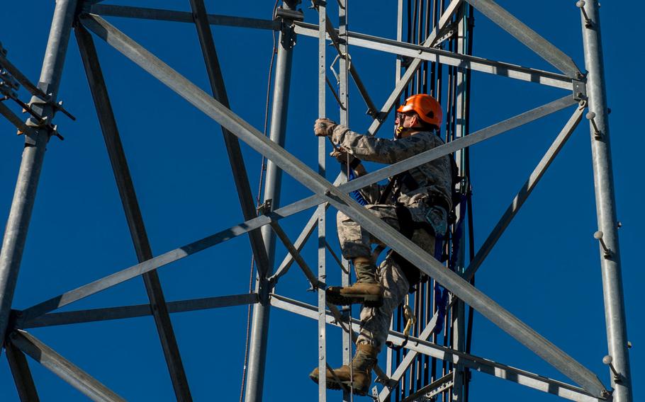 U.S. Air Force Senior Airman Anthony Tressel, radio frequency transmission technician with the 628th Communications Squadron, inspects a ultra high frequency (UHF) antenna for wind damage caused by Hurricane Matthew  on Joint Base Charleston, S.C., Oct. 10, 2016. Joint Base personnel are working diligently to return the Joint Base to full operational status after disaster response coordinators assessed damage and verified a safe operating environment.