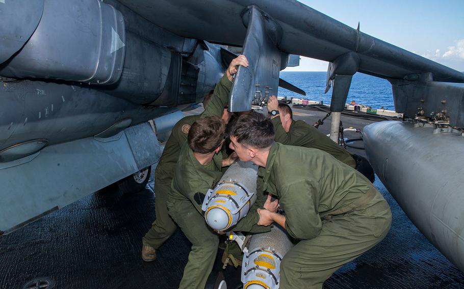 Marines attach a GBU-54 laser joint direct attack munition bomb to an AV-8B Harrier aboard the amphibious assault ship USS Wasp. The 22nd MEU, embarked on Wasp, is conducting precision air strikes in support of the Libyan Government of National Accord-aligned forces against Islamic State targets in Sirte, Libya as part of Operation Odyssey Lightning.