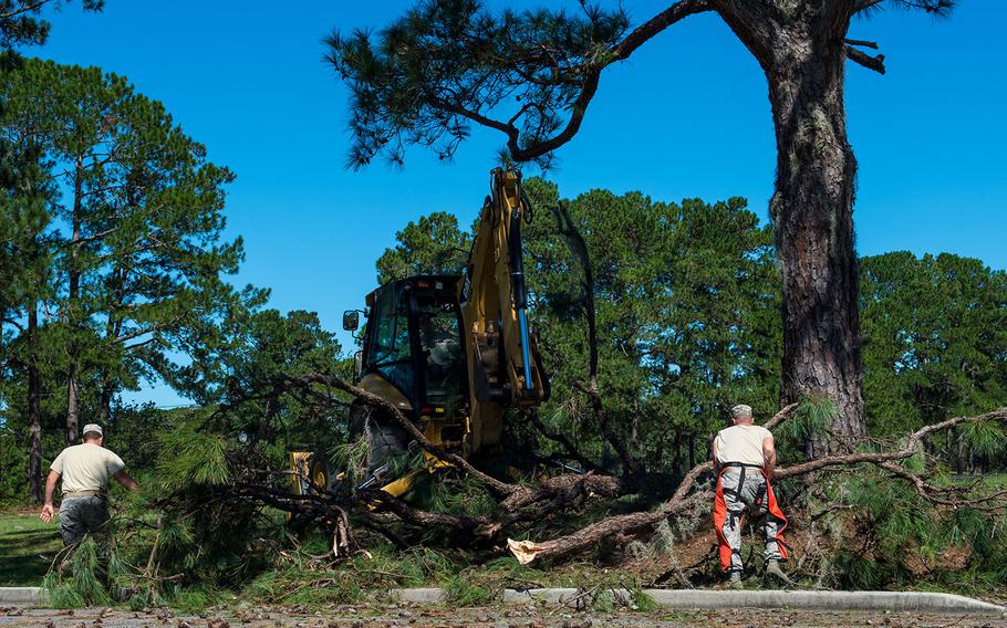 U.S. Air Force civil engineers with the 628th Civil Engineer Squadron tear down broken tree limbs on Joint Base Charleston, S.C., Oct. 9, 2016. Disaster response coordinators were sent to assess Hurricane Matthew damage.