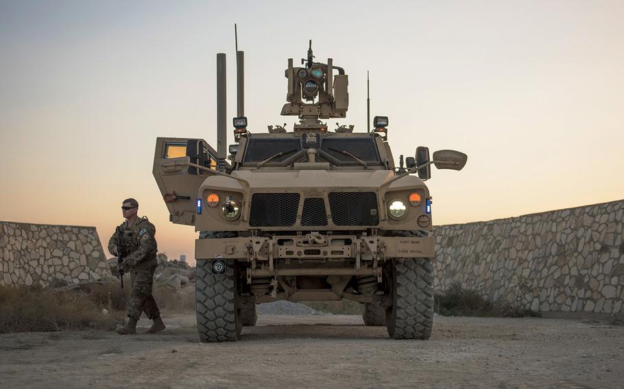 Senior Airman Michael Van Deusen, 455th Expeditionary Security Forces Squadron quick reaction force, gets out of a mine-resistant ambush-protected (MRAP) vehicle during patrol, Bagram Airfield, Afghanistan, Sept. 27, 2016. Freedom's Sentinel, the follow-on to Enduring Freedom, is the continuing U.S. effort to train, advise and assist Afghan security forces as well as conduct counterterrorism operations in Afghanistan.