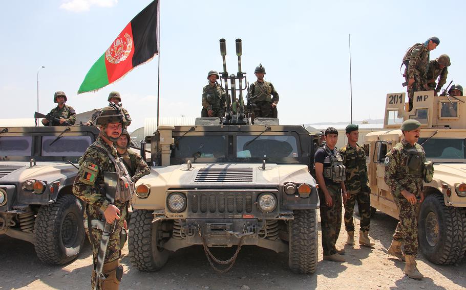 Afghan National Army soldiers prepare to move out following an inspection of troops at the Regional Military Training Center at Tactical Base Gamberi, Afghanistan, on July 30, 2015.