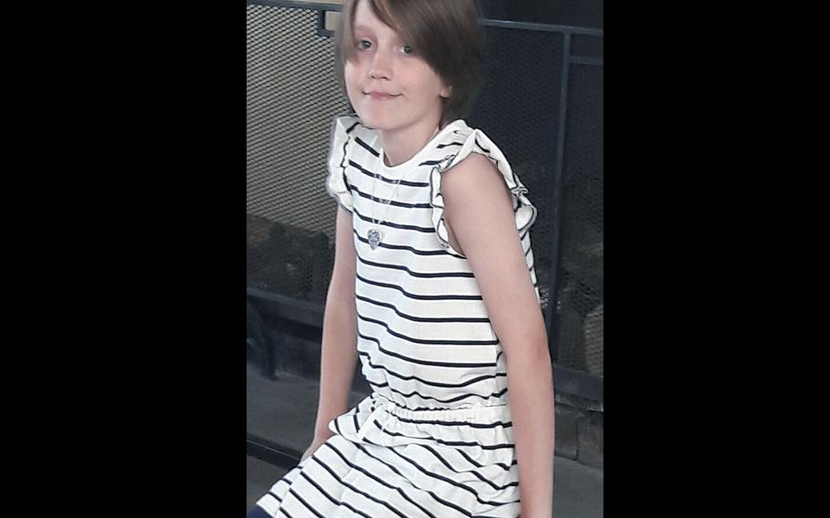 A recent photo of Blue, the 11-year-old daughter of a U.S. airman at Ramstein Air Base, Germany, may now use the girls bathroom at her base school, after initially being denied access to it. The Department of Defense Education Activity said all openly transgender students will now be able to use the restroom and locker room of their gender identity as part of a new transgender student policy.