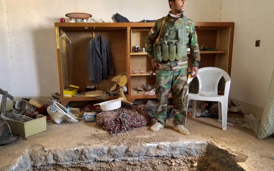 Ibrahim Hussein, 23, a peshmerga soldier near a tunnel leading to the underground hideout of an Islamic State leader reportedly killed in Shakoli during the Mosul offensive on Oct. 20, 2016. The tunnel was outfitted with extremist graffiti, electricity, appliances, stockpiles of food and, potentially, booby-traps. 