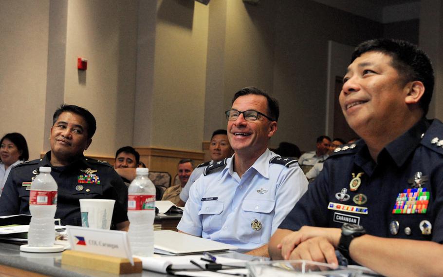 Maj. Gen. Conrado V. Parra, Jr., vice commander of the Philippine Air Force, left; Maj. Gen. Mark Dillon, U.S. Pacific Air Forces vice commander, center; and Col. Fermin M. Carangan, Philippine Air Force assistant chief of air staff for operations, participate in briefings during the fifth annual U.S. and Philippine Airman-to-Airman Talks at Joint Base Pearl Harbor-Hickam, Hawaii, Aug. 30, 2016.