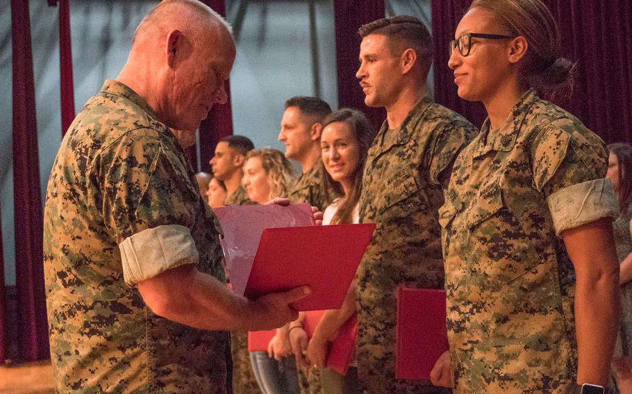 Twenty-one Marines reenlisted on the spot on Oct. 27, 2016 at Camp Foster, Okinawa. 