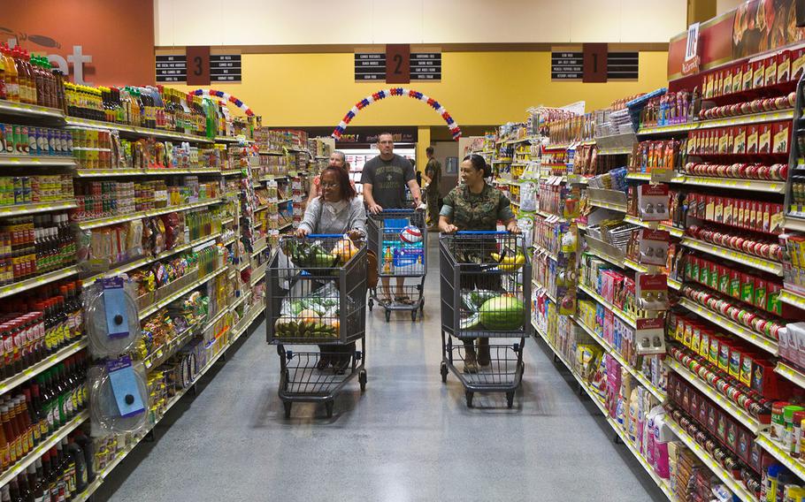 Customers walk through the new commissary at Marine Corps Air Station Iwakuni, Japan on June 21, 2016. 