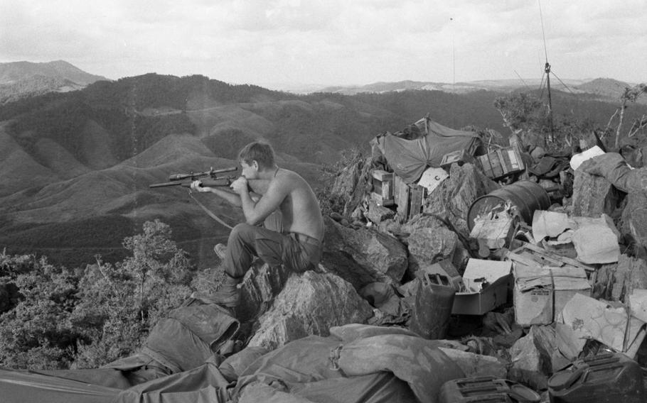 An unknown Marine scans for enemy threats from atop the Rockpile in November 1966. 